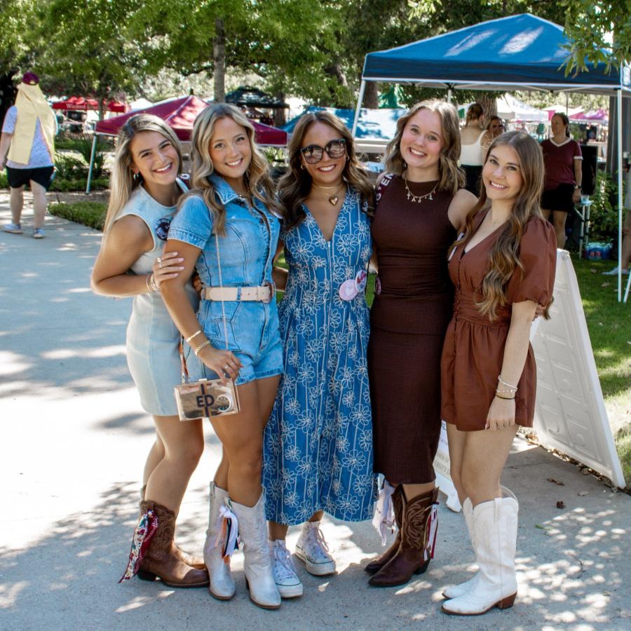 The essence of exceptional living a group of women posing for a photo